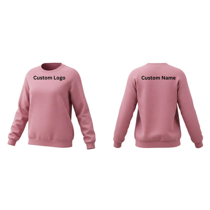 A woman wearing a cozy high-quality fleece sweatshirt with ribbed cuffs and a relaxed fit, standing in a casual outdoor setting. Designed for comfort, durability, and custom branding opportunities.